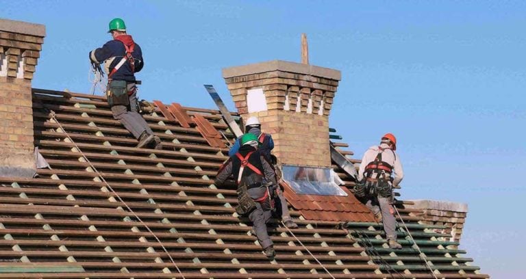 roofers installing new roof; roofing materials