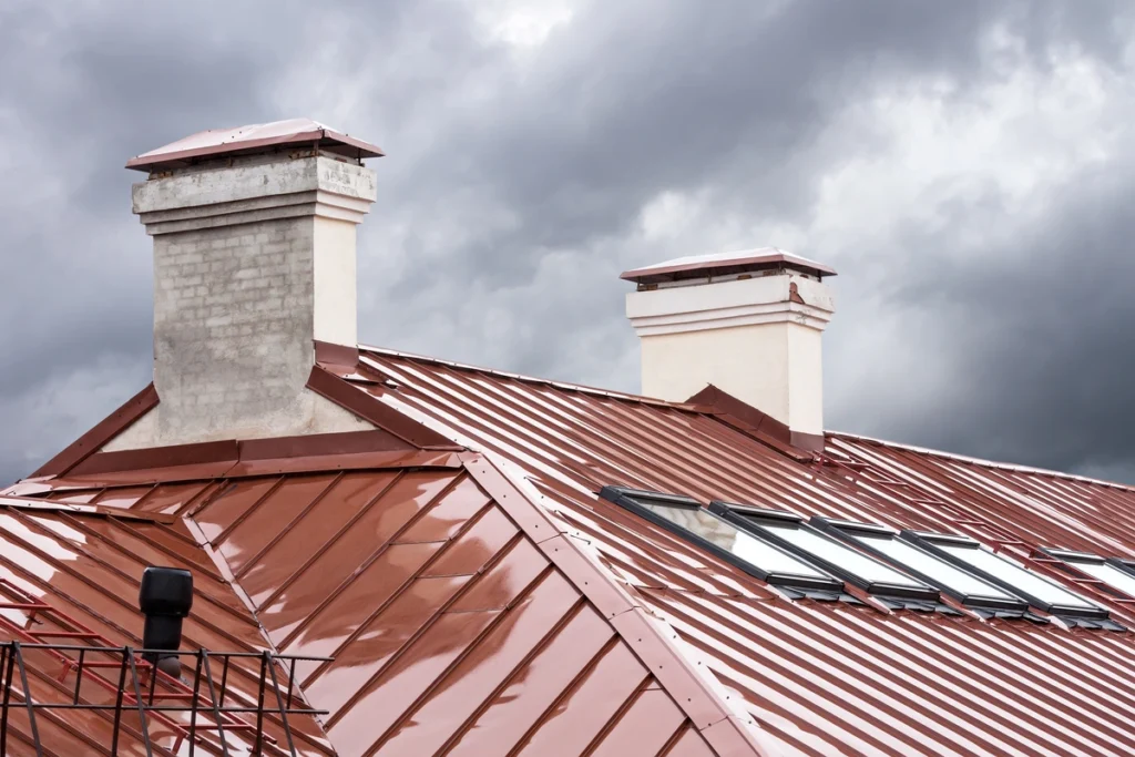 red metal roof with flashing preventing water damage during rain