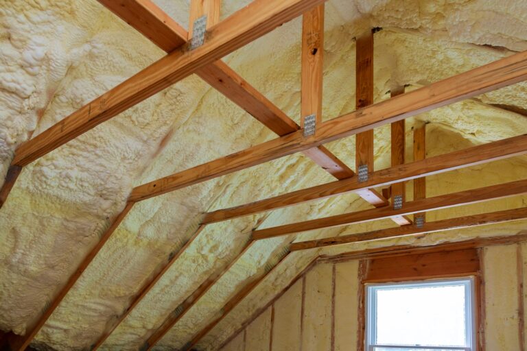 An insulated attic of a house, raising attic insulation cost