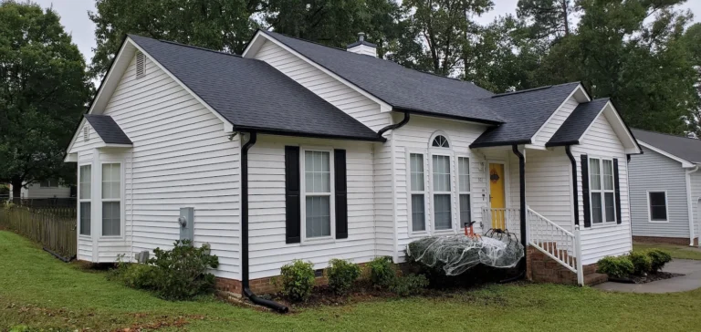 a white house with a black roof