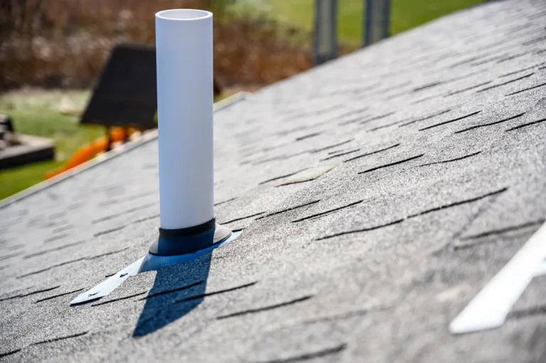 white roof boot on an asphalt roof