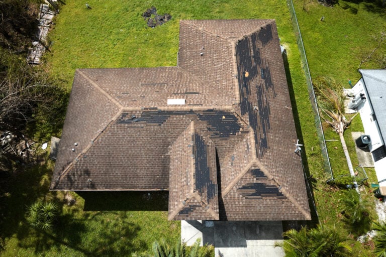 missing shingles-arial view of missing shingles on a brown roof