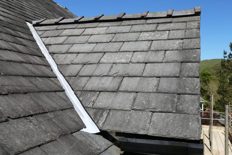 slate roof cost-profile view of house roof with slate shingles