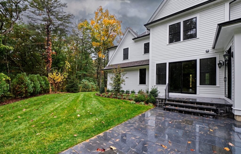 Autumn colors fade as a rainy breezy day soaks the back patio and garden