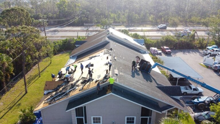 Roofing Companies In Mount Vernon VA workers installing shingles aerial view