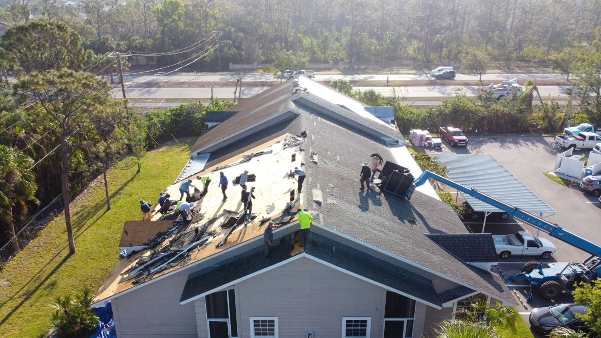 Roofing Companies In Mount Vernon VA workers installing shingles aerial view